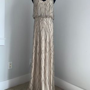 Elegant, beaded spaghetti strap beige gown